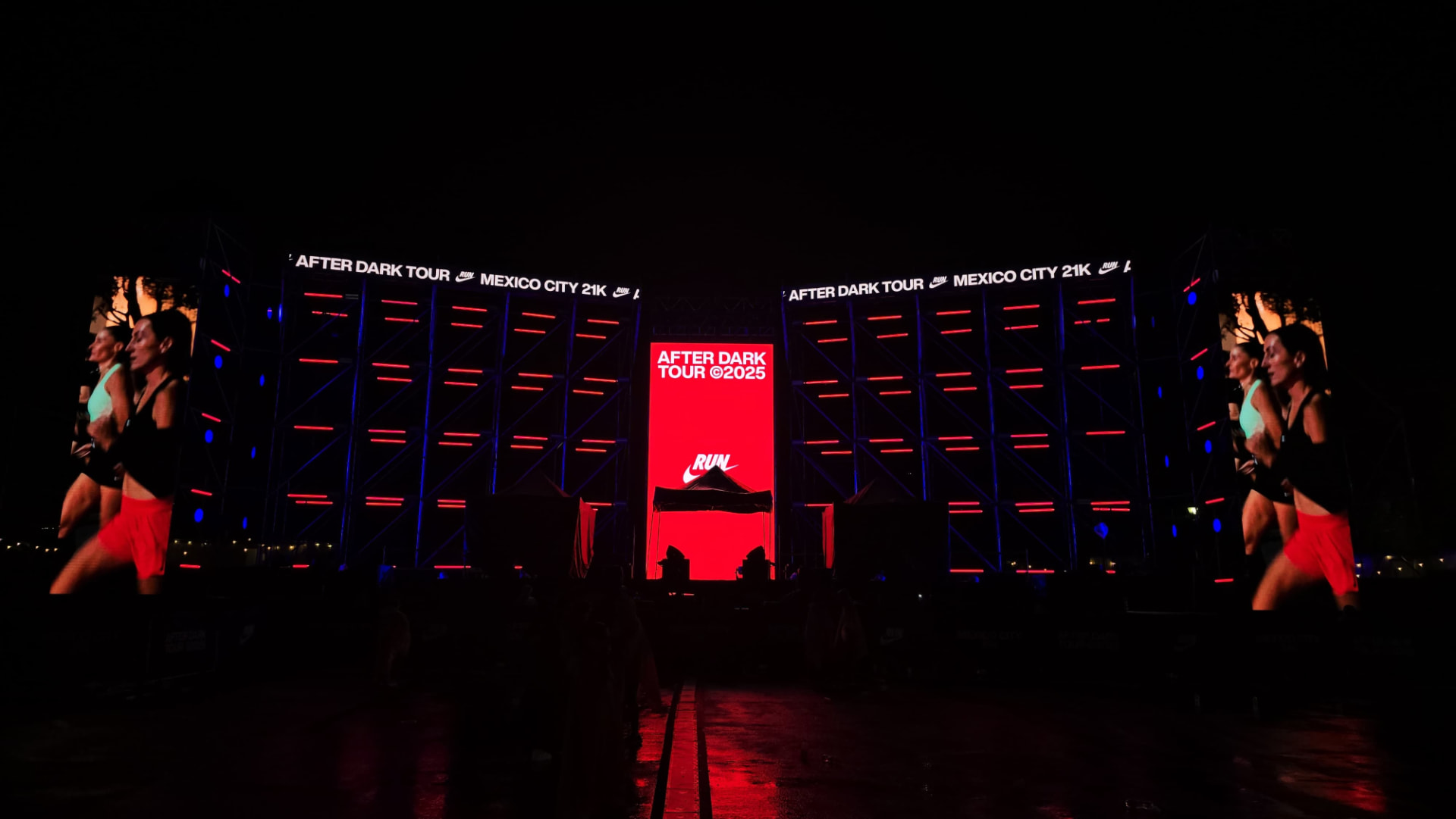 Nike After Dark Tour stage in operation with runners on the lateral screens