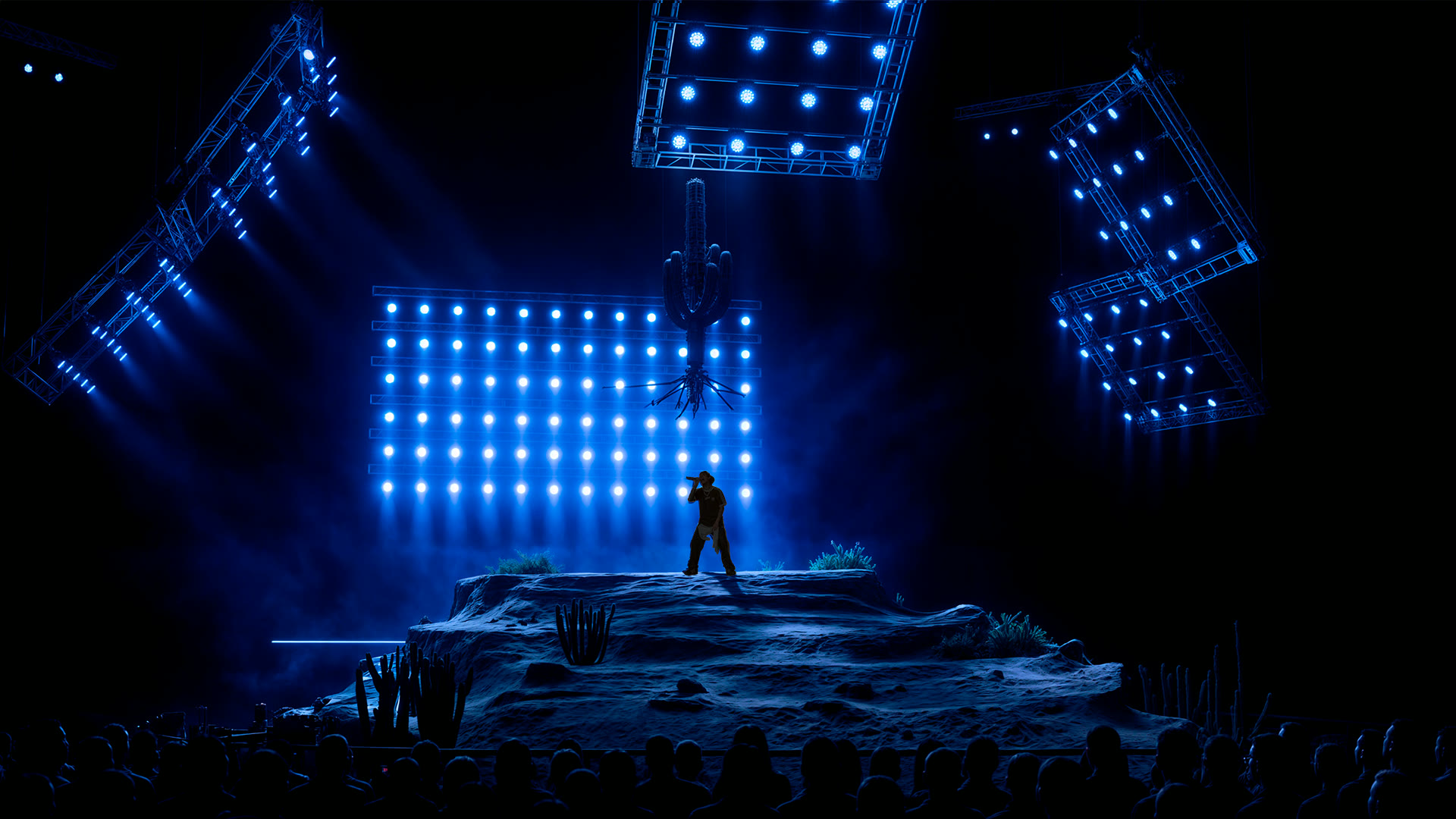 Render: blue-lit general view of the scenic dune with the performer and lighting rigs